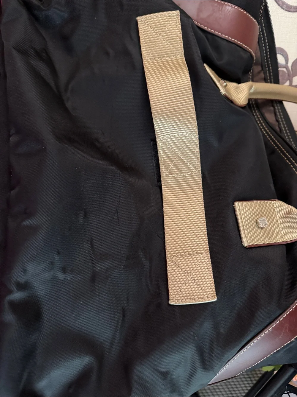 Black Duffel Bag with Tan Handles and Brown Accents
